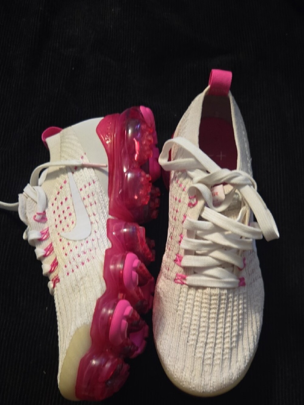 Nike Air VaporMax Flyknit 3 sneakers in the "Pink Rise" or "Laser Fuchsia" color